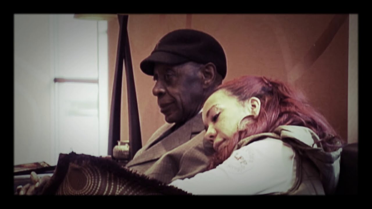 Tiny Harris and her dad singing