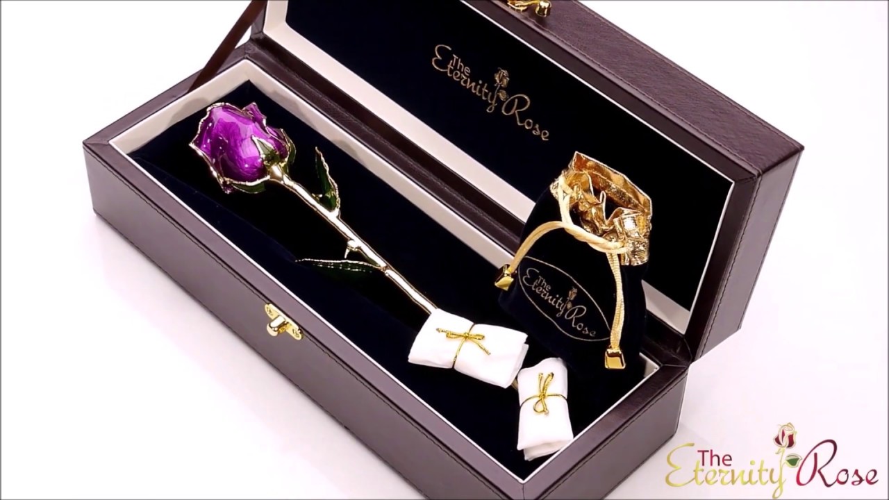 A natural red rose glazed and gold trimmed, paired with matching jewelry made from real rose petals