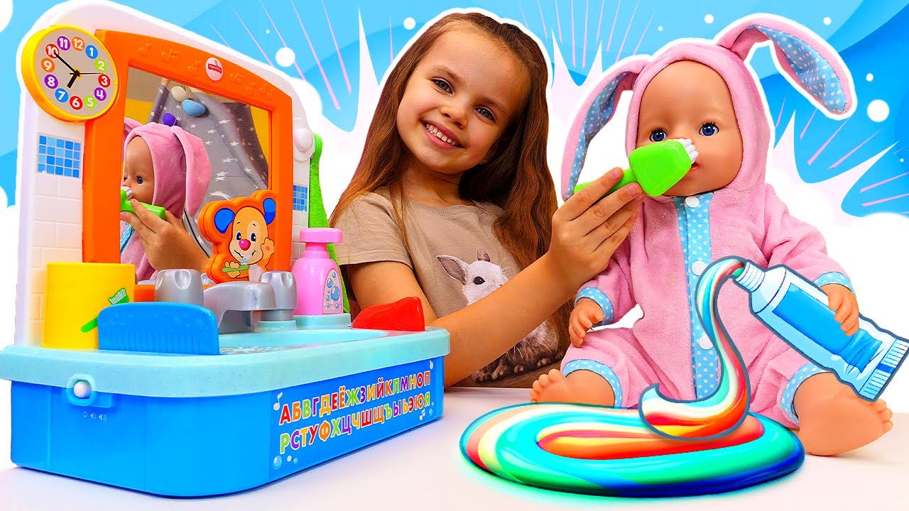 Maya teaches her doll the importance of brushing her teeth and fighting germs.