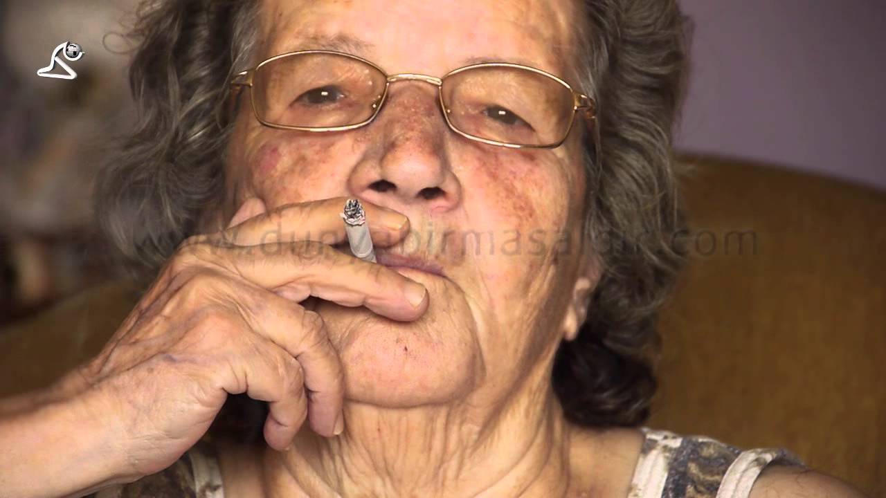 Stock Footage: grand mother very old woman smoke cigarette enjoy smoking