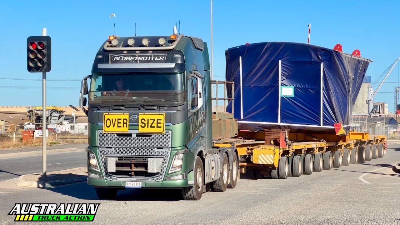 Volvo FH16 hauling oversize load with police escorts!