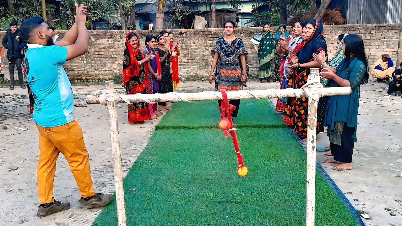 Everyone in the village is excited to tie the ball to the goalpost and win the prize.