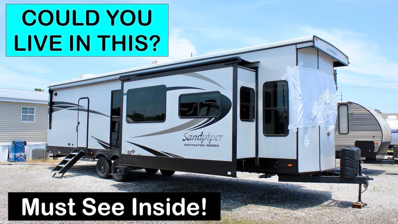 We aren't CAMPING anymore! Checkout this STUNNING Sandpiper Park Model with no holding tanks!