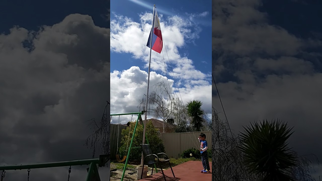 Flag raising with Julien, my lil' garden helper