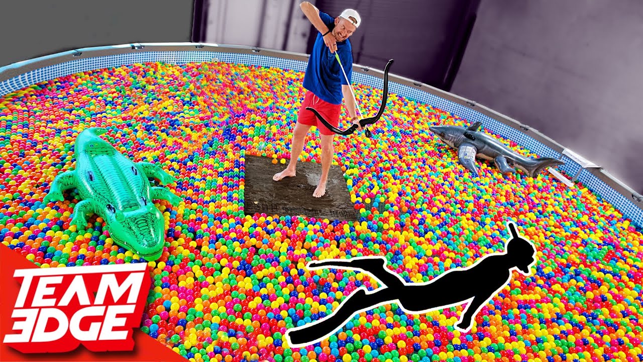 Shoot the Person Swimming in the Ball Pit!! | 10,000 Play Balls in a Pool!!