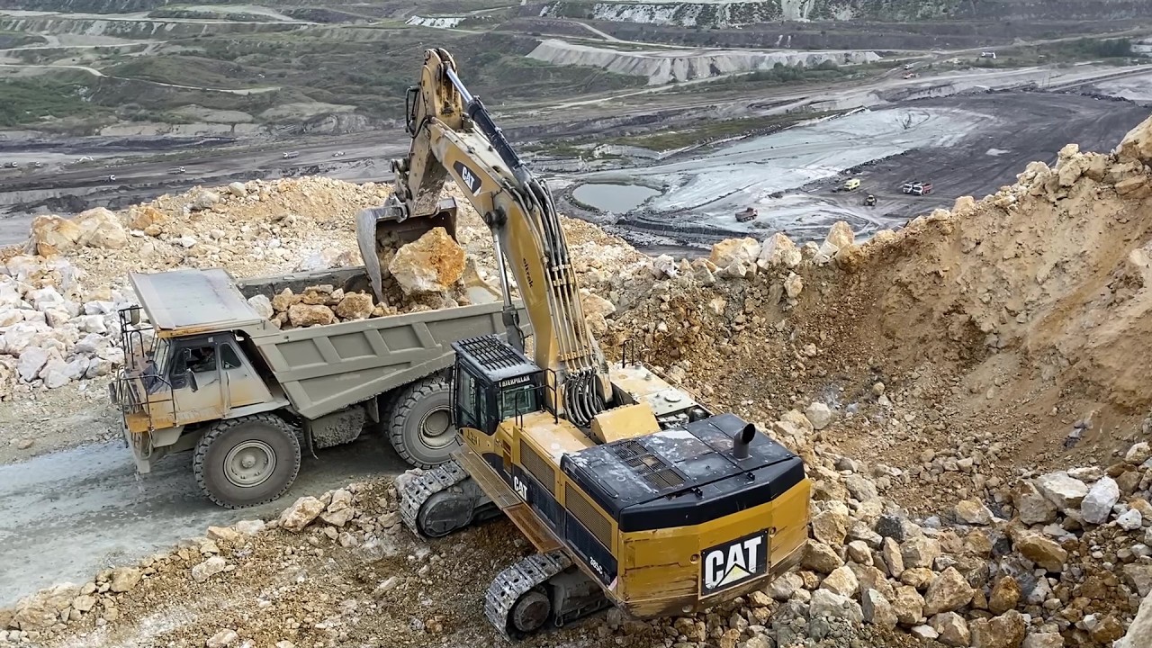 Cat 385C Excavator Loading Cat 775E Dumpers With Blasted Materials - Pyramis Ate