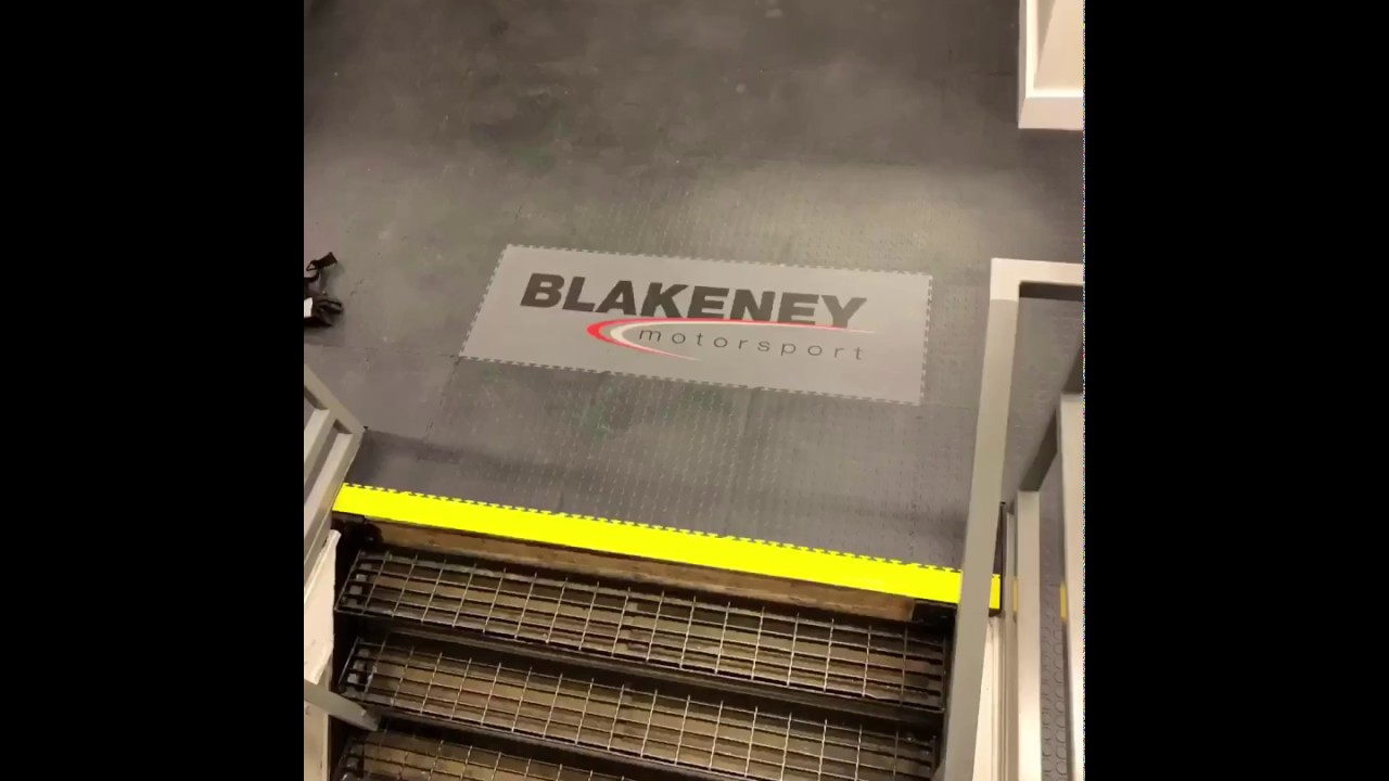 Branded company logo pvc floor tiles fitted. Pvc garage/ workshop flooring Installation