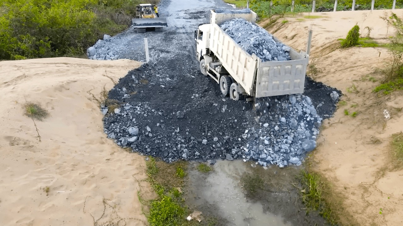 Work Road Construction Powerful Bulldozer Clearing Rock In Road Work With Nice Operator Dump Truck