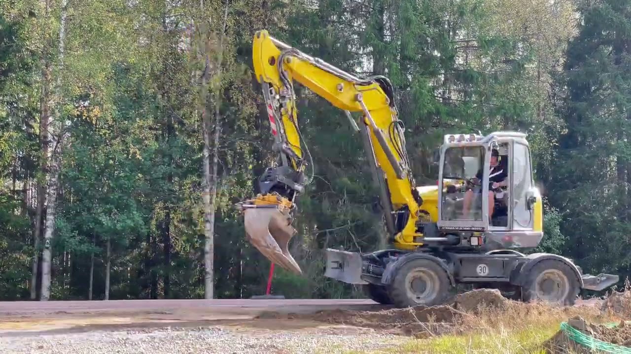 WACKER NEUSON EW100 with Engcon tiltorator and SMP grading bucket