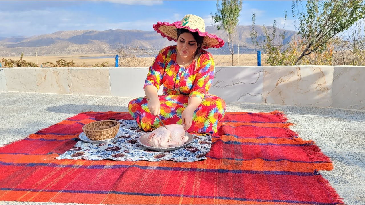 Cooking chicken with mountain herbs in a traditional Iranian village