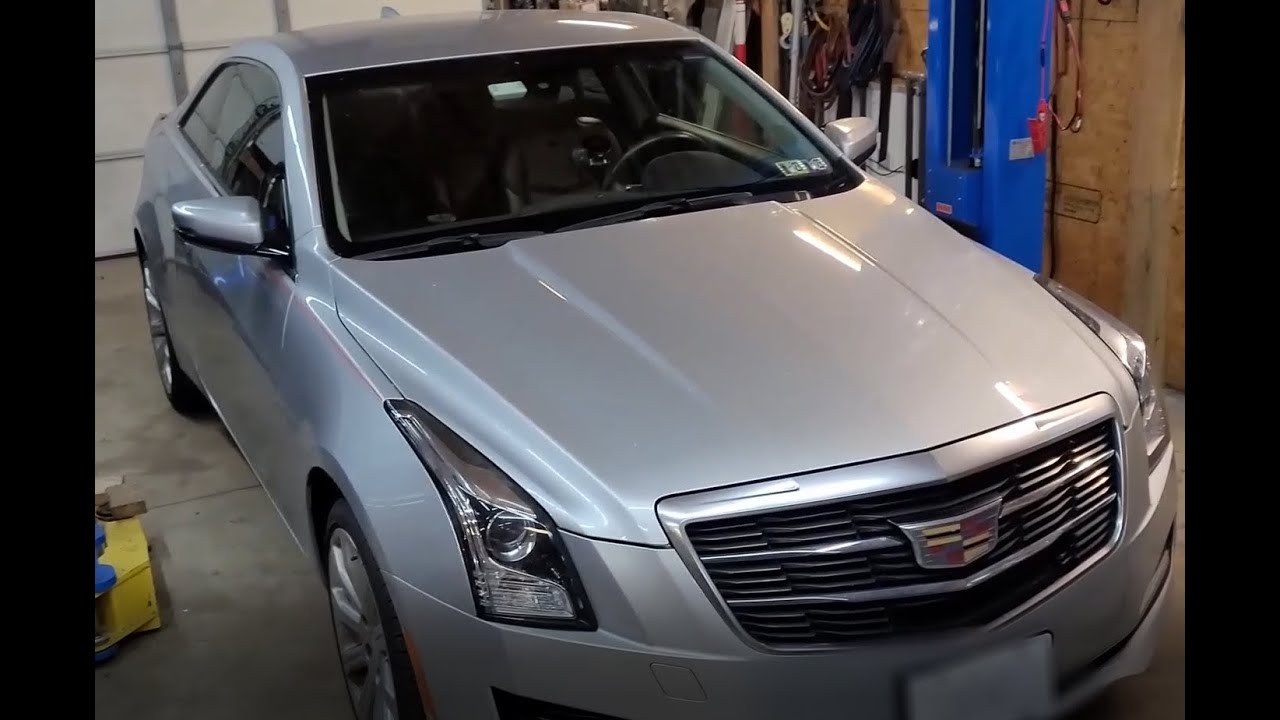Замена заднего амортизатора Cadillac ATS 2016. Ремонт кронштейна выхлопной системы.