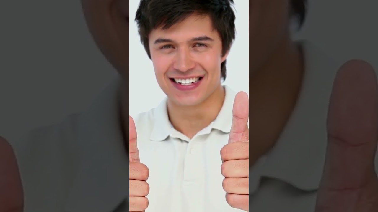 Happy Man Giving Thumbs Up Against Plain Background Video | WaveBreak Media #shorts