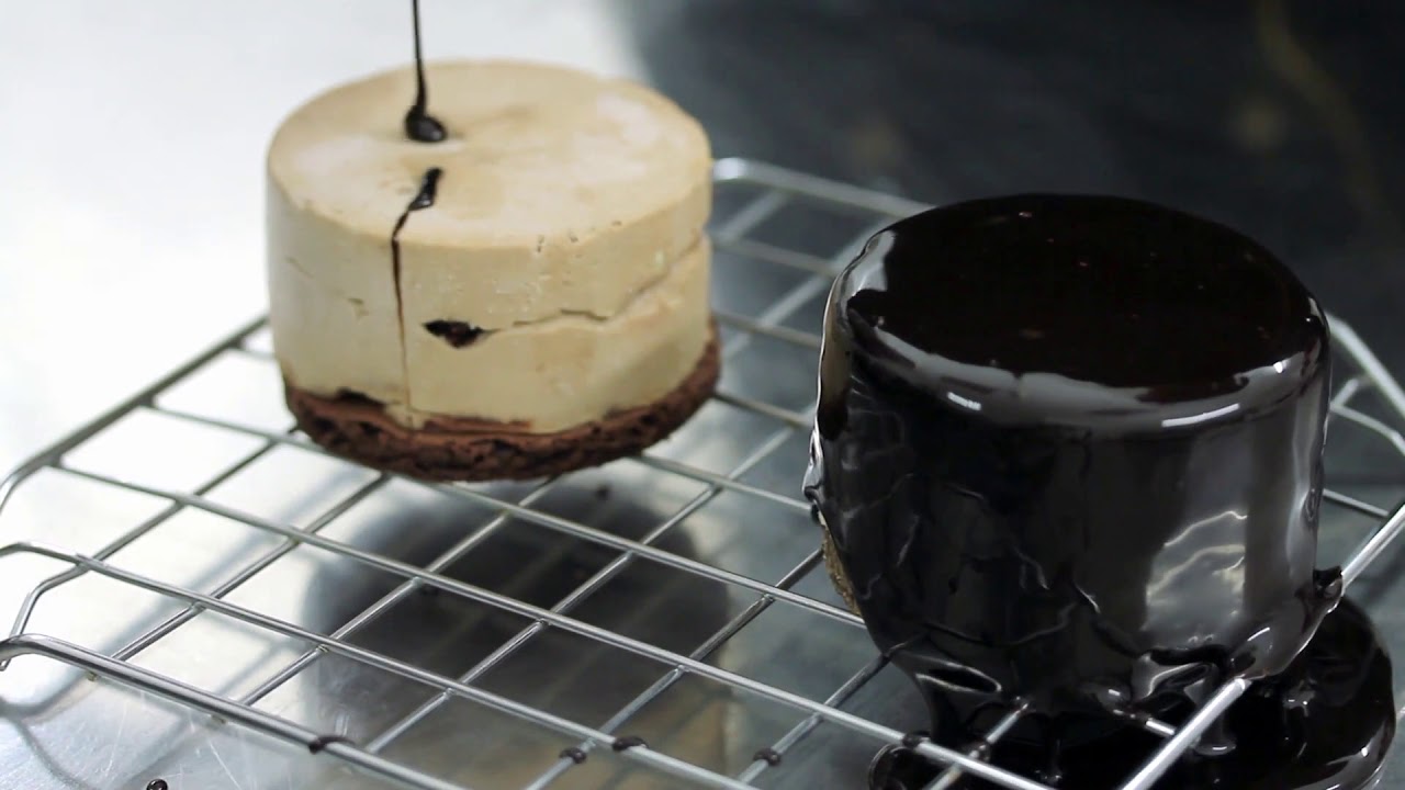 professional confectioner making mono portion cakes and puts a