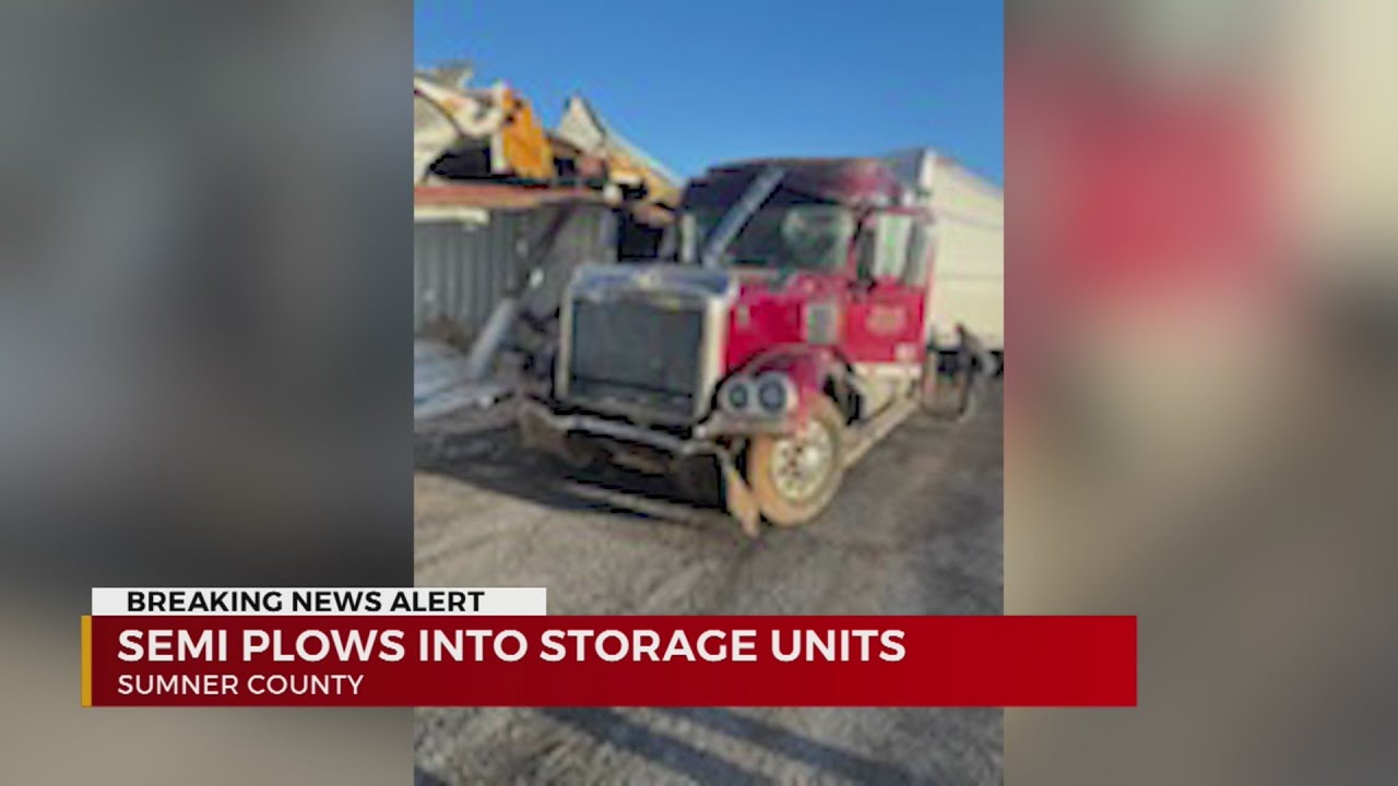 Semi plows into storage units