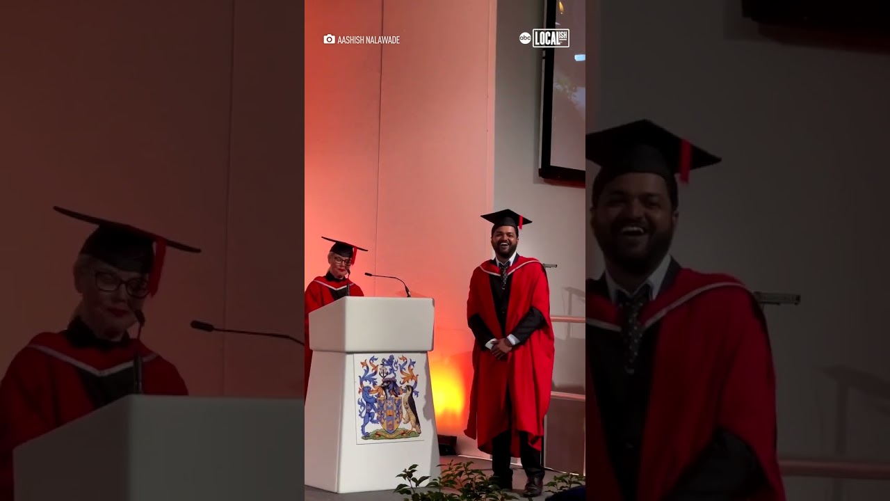 Daughter cheers on dad during graduation