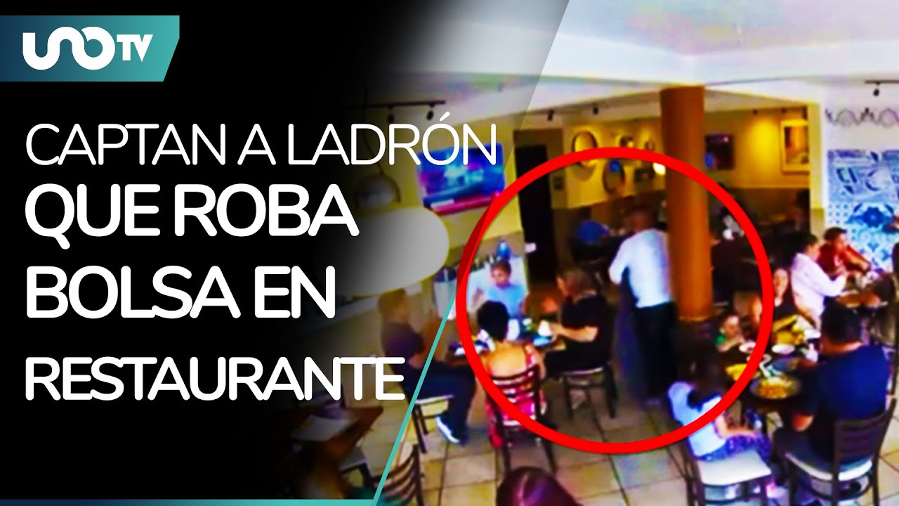 Video: captan a ladrón de bolsa en restaurante; usó su abrigo para esconder el botín