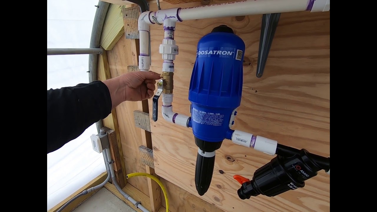 We hook up a new dosatron for the third greenhouse