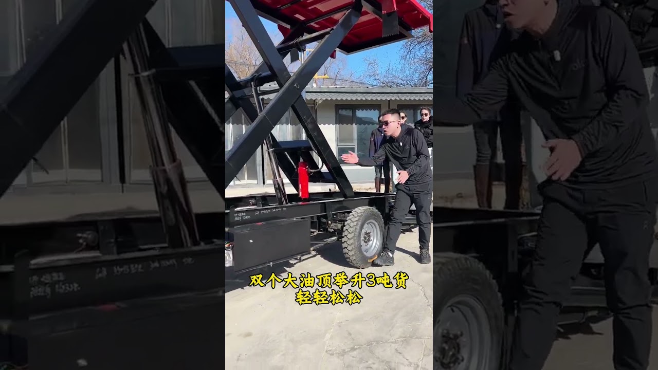 Electric lift truck equipped with dual hydraulic cylinder lifting tailgate. "Electric flatbed truck