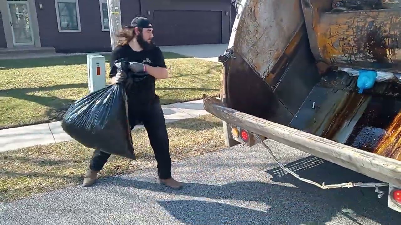 Trash Truck All Round View. Smashing Diapers Straight On The Blade