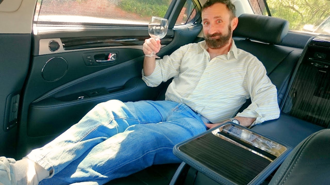 Riding in the luxurious back seat of the $140K Lexus LS 600h L