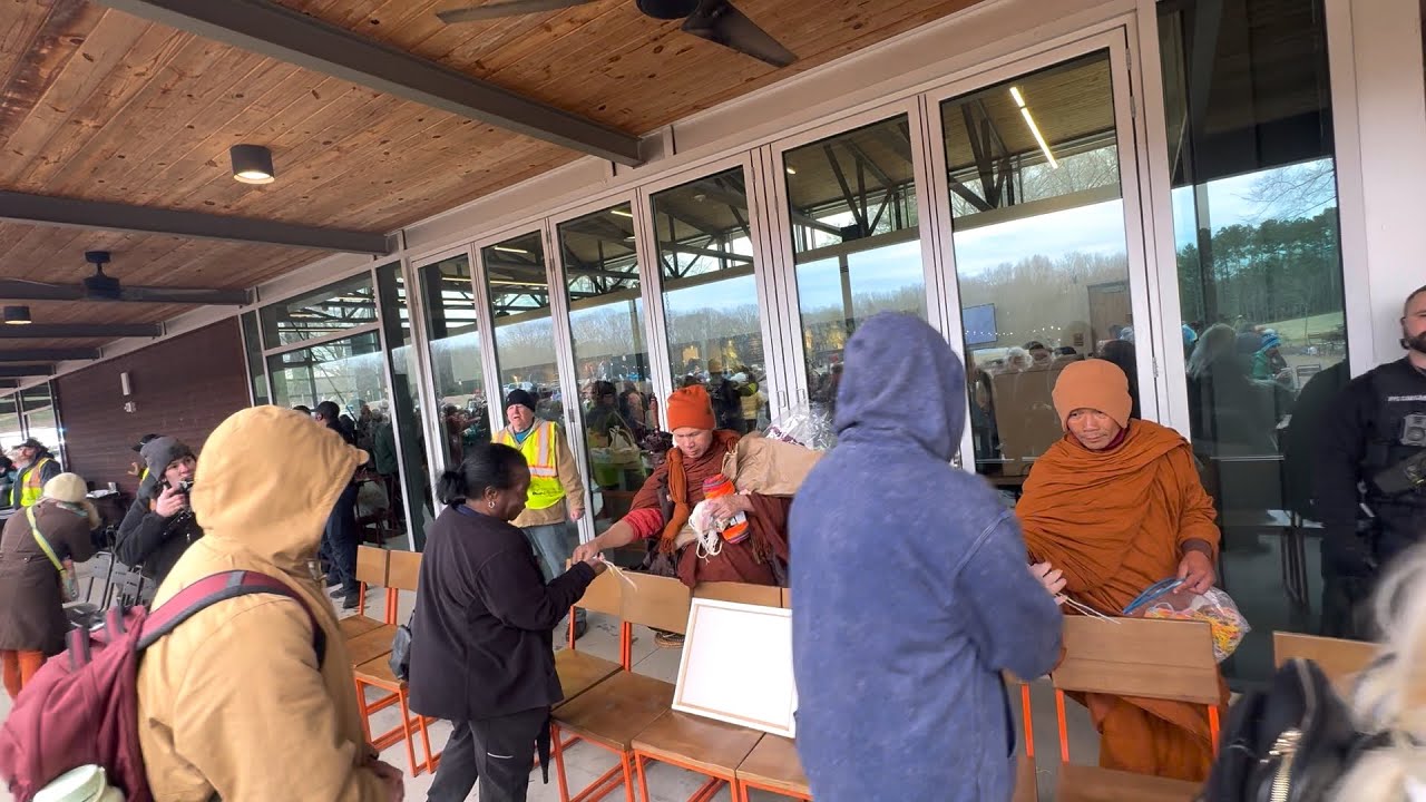 The monks happily gave lucky charm bracelets to everyone.