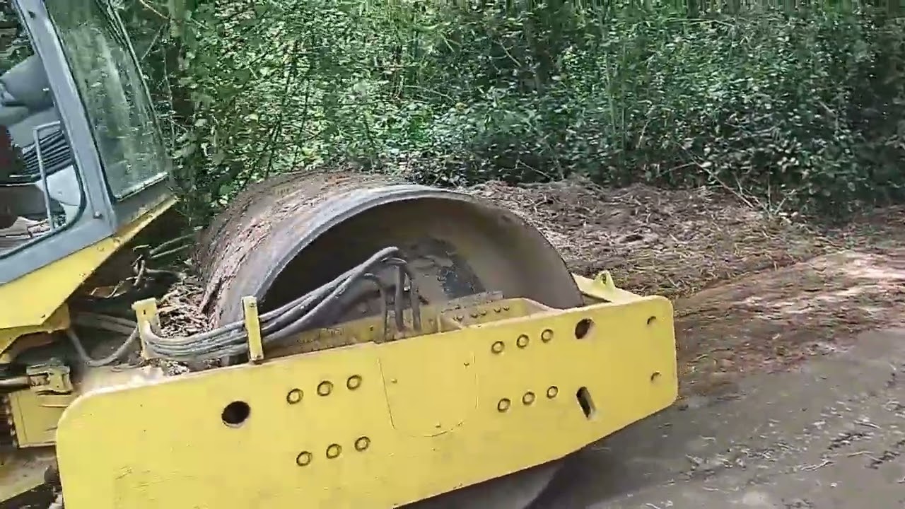 with a vibrating roller the new road is taking shape