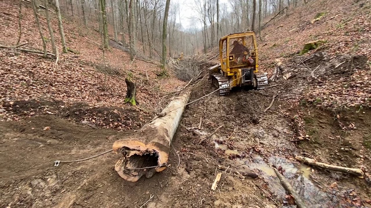 Logging Culverts. John Deere 650, John Deere 310c