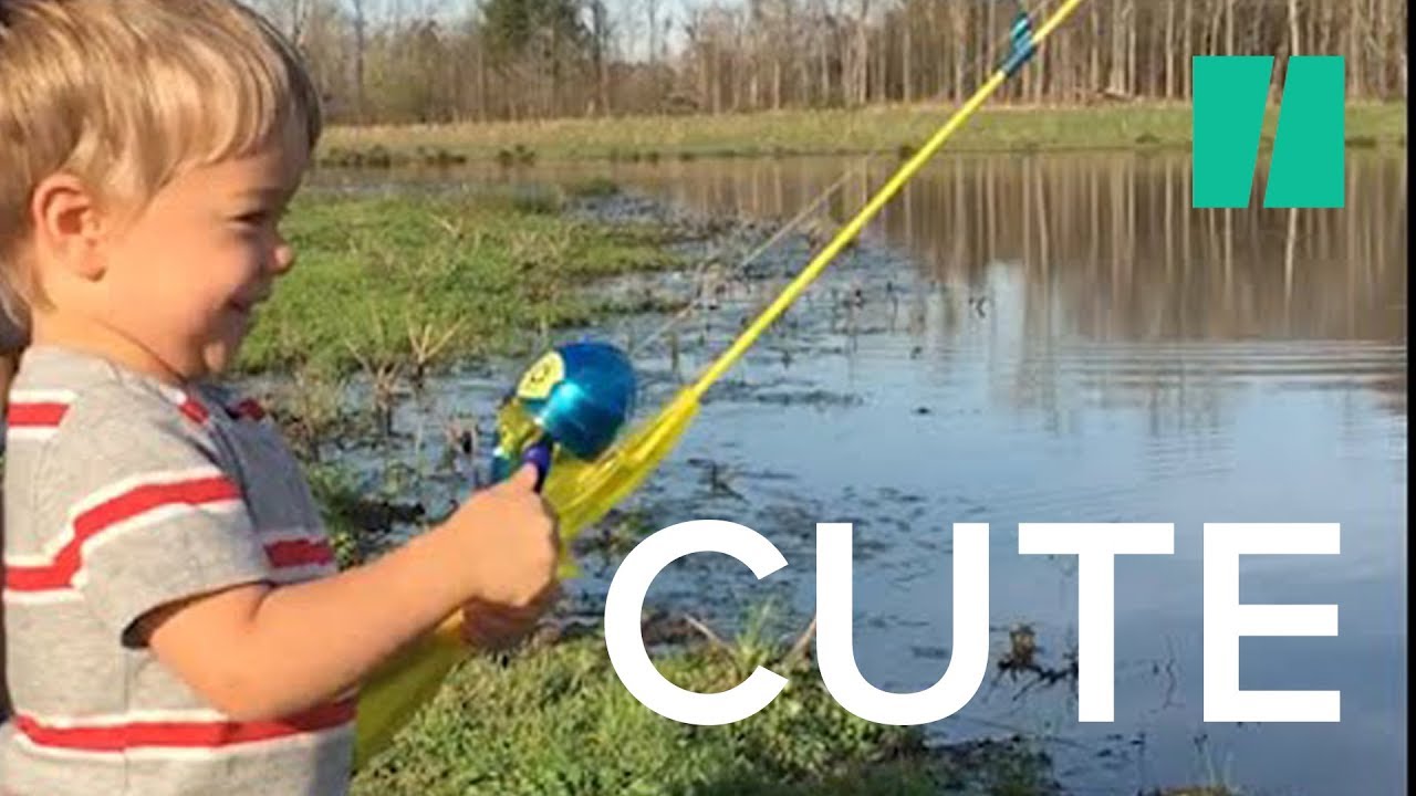 Little Boy Catches Fish with Toy Rod