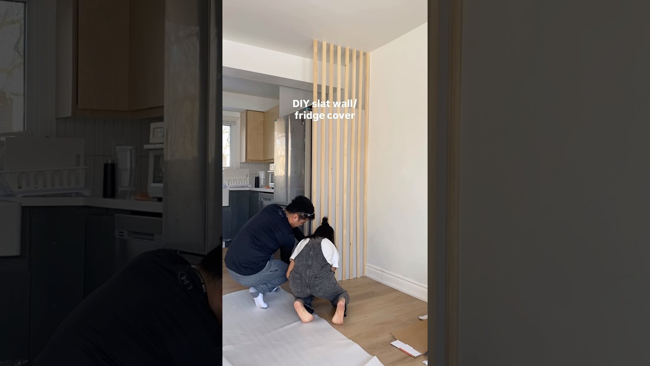 Separating our open concept kitchen and living room with a slat wall! #diyhome #smallspaces