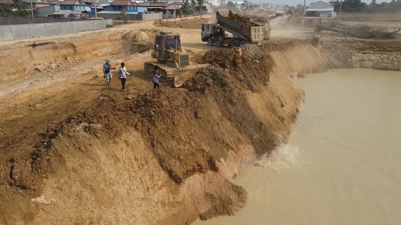 Amazing Processing Land Filling Deep Pond In Flooded Area Use Operator Bulldozer and Dump Truck