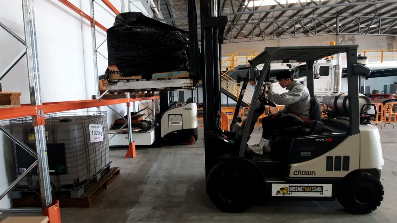 Korean forklift (racking) of putting pallets away.