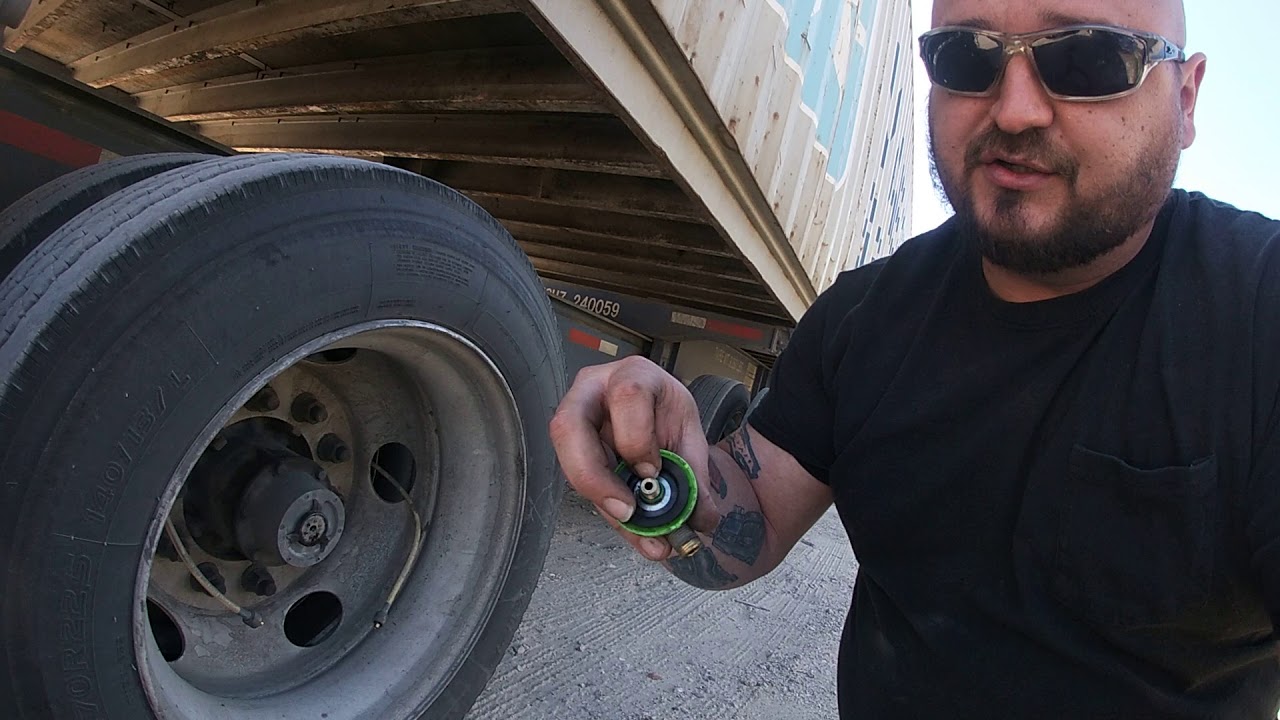 Self inflating or buddy system T valve for tires on a 18 wheeler chassis