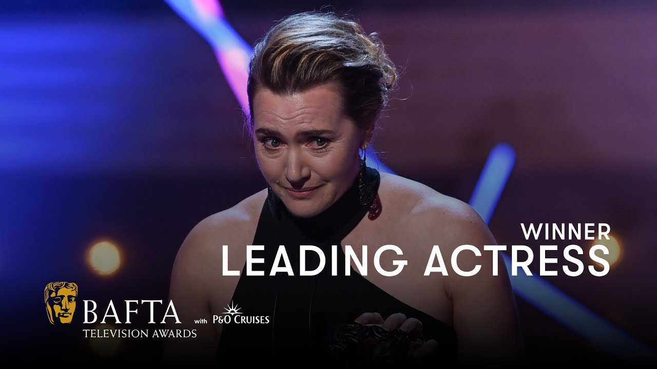 Kate Winslet accepts the Leading Actress award with her 