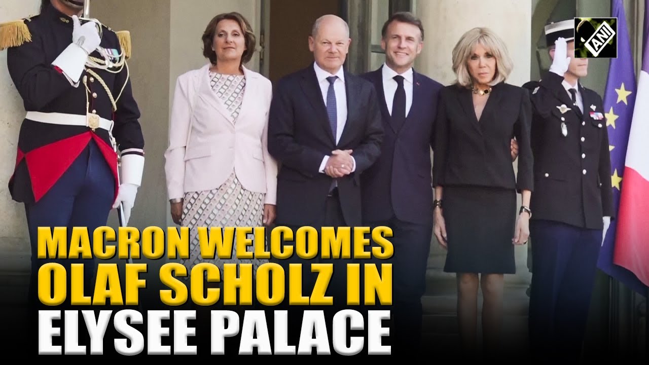 French President Emmanuel Macron welcomes Germany’s outgoing chancellor Olaf Scholz to Elysee Palace