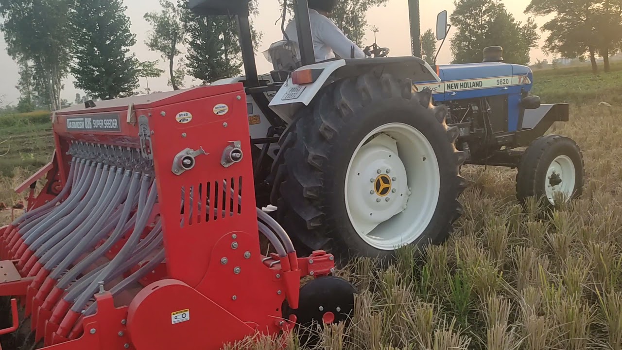 New Holland with Dasmesh Super Seeder.