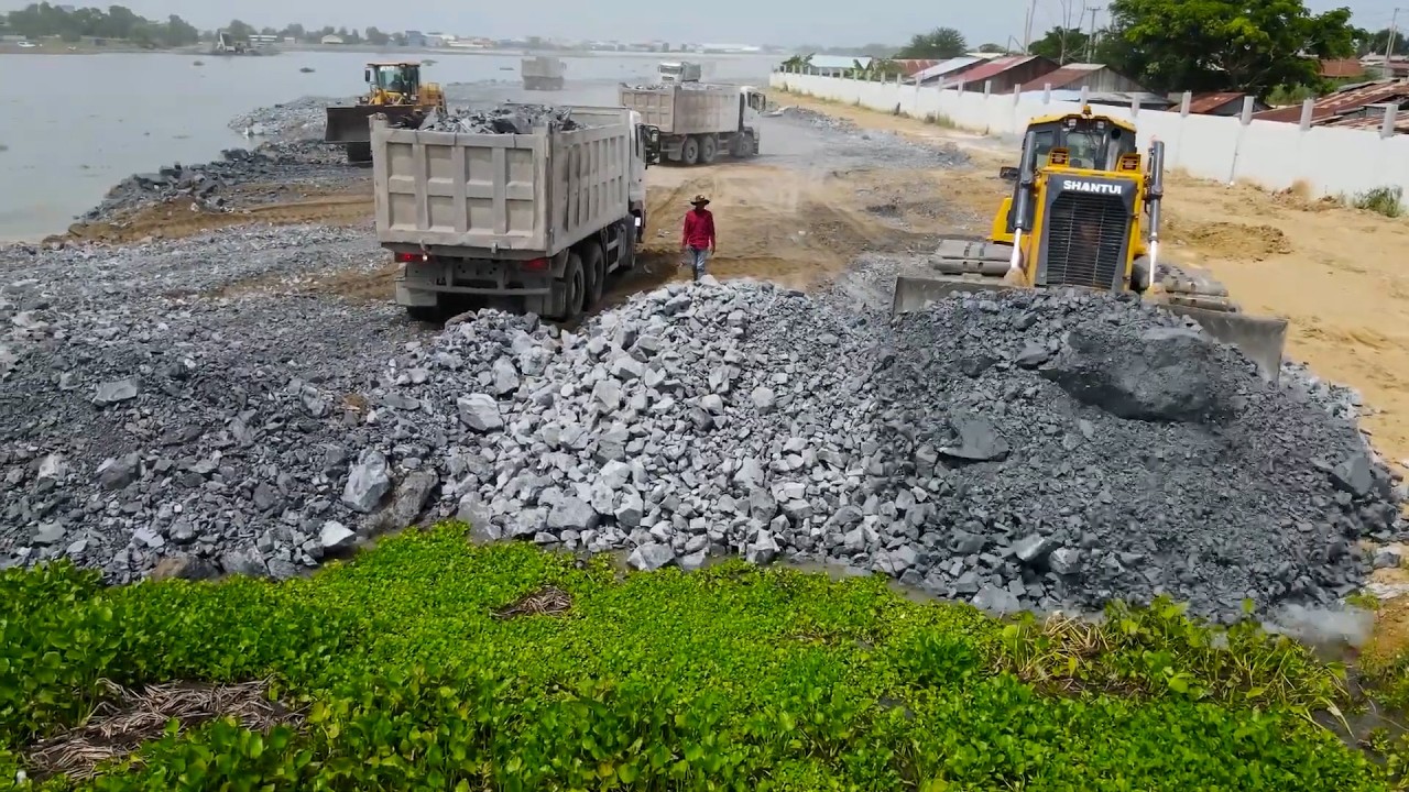 Best Action Filling Stone Huge Lake With Bulldozer And Wheel loader Move Stone and sand in water