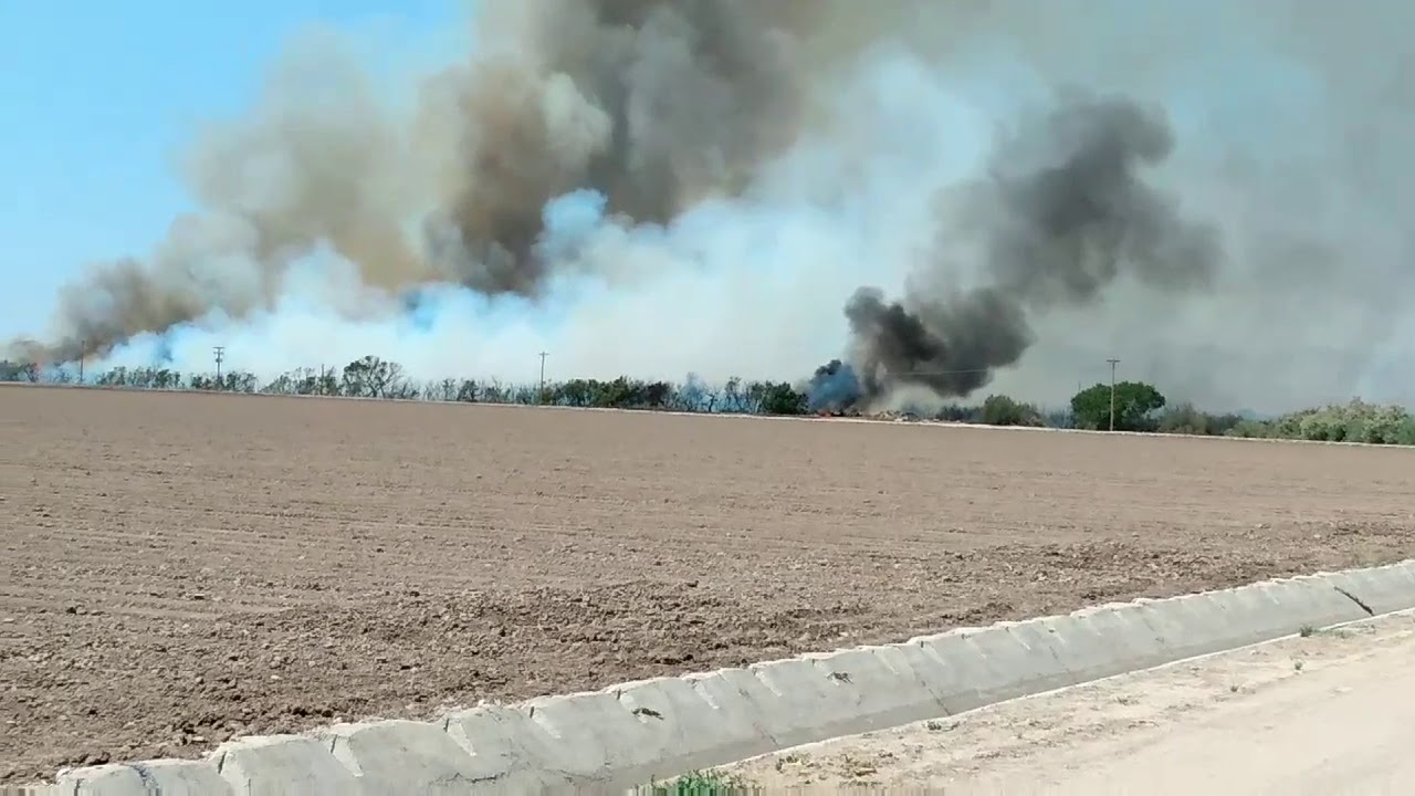 Fire in Thatcher Az. The brush by the river is burning out of control...