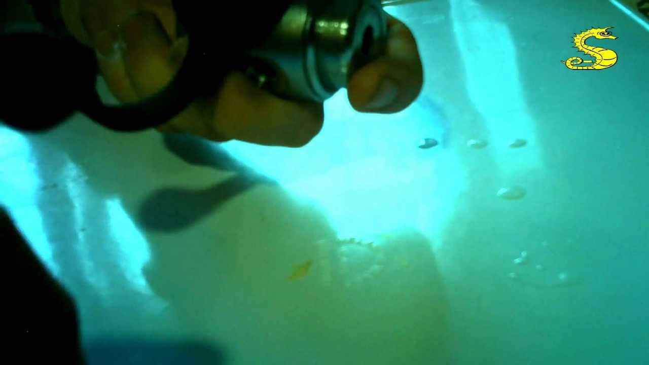 Montaje de primera etapa de regulador, por e-Submarinismo.es