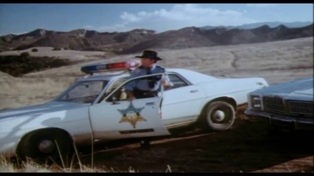 Motorcycle chase and crash Hazzard Style