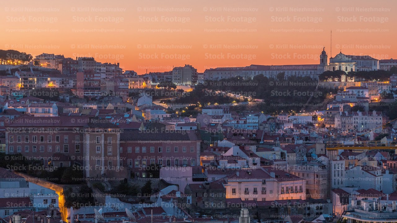 Lisbon aerial cityscape skyline night to day timelapse from viewpoint of St. Peter of Alcantara