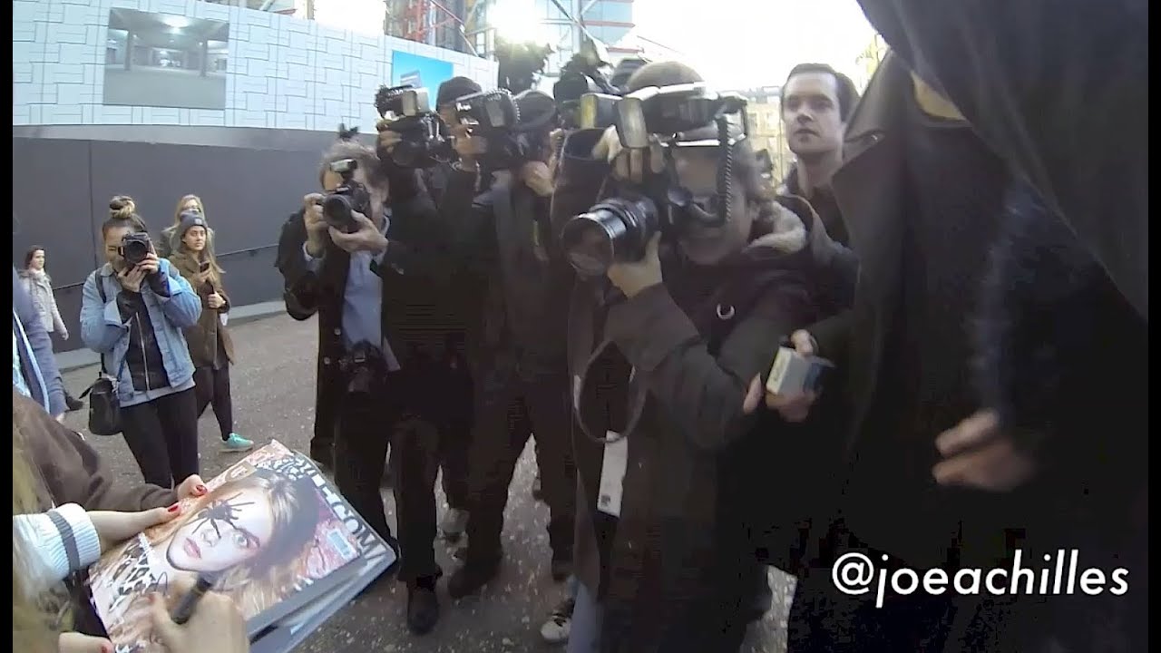 A Video of Cara Delevingne leaving the AW 2013/14 TopShop Unique Show - Paparazzi fall/fail