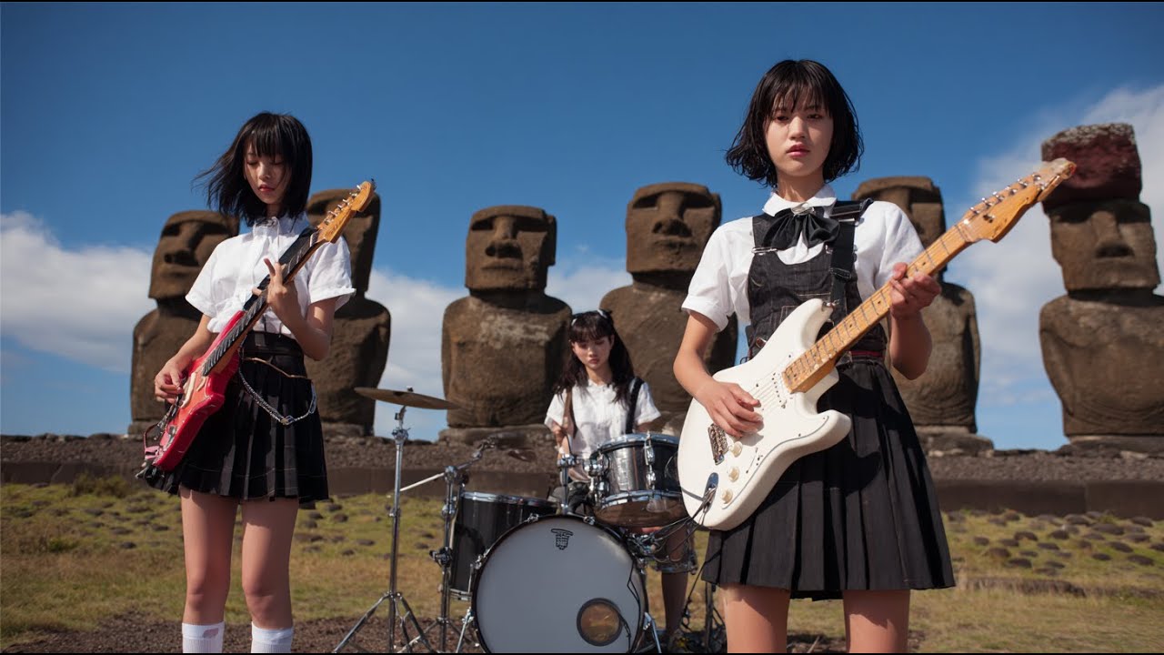 High School Girls Band and Moai Statues