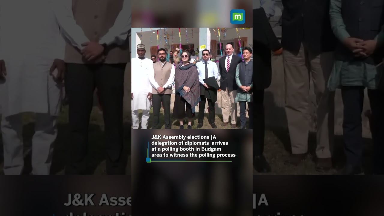 A delegation of diplomats  arrives at a polling booth in Budgam to witness the polling