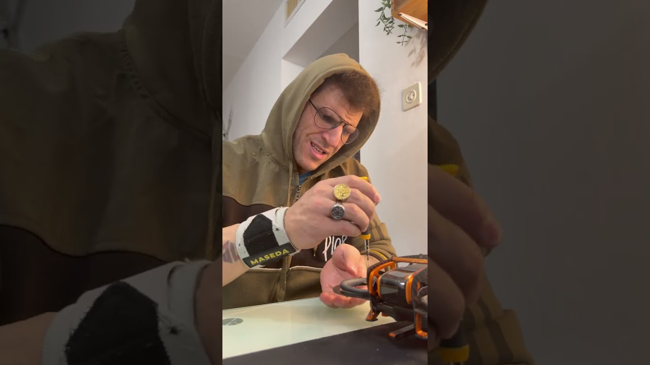 Disassemble the drone  protection by removing each screw.