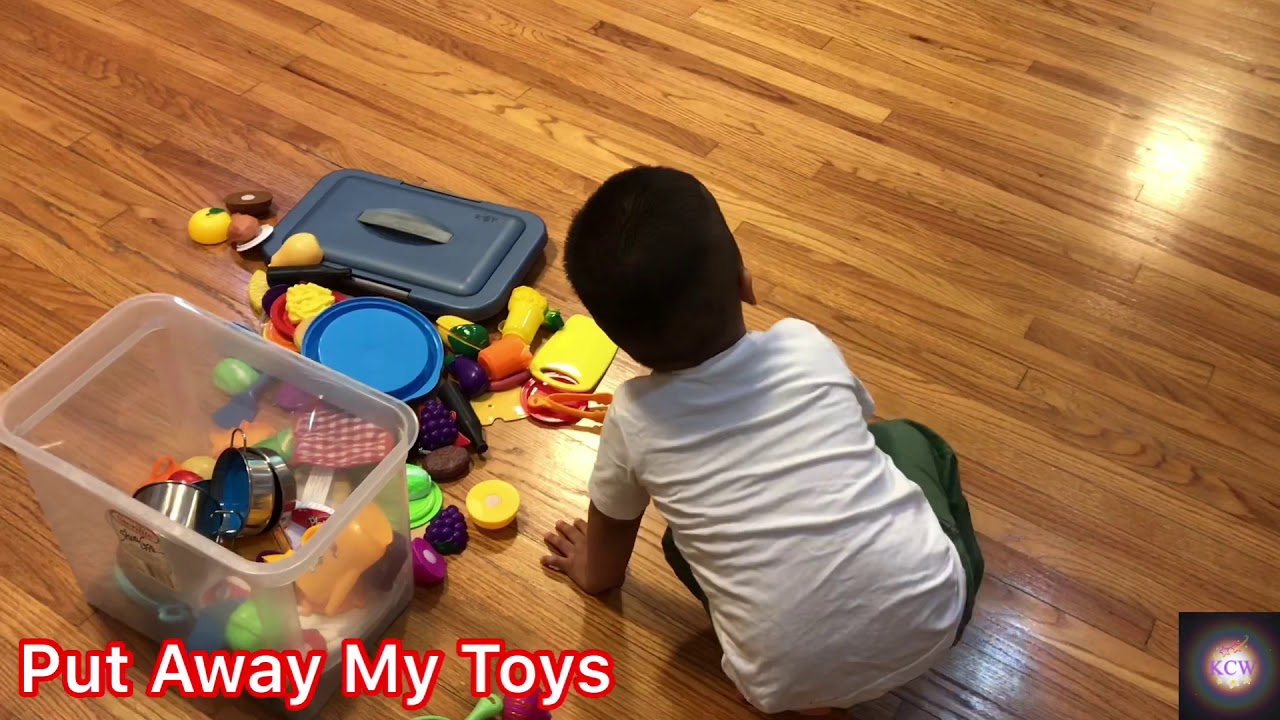 Toddler Puts Away Toys after Playing