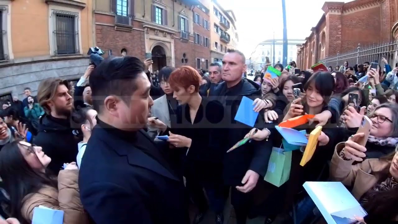 Seventeen's DK 도겸 signing autographs for Milan fans for the Bally fashion show