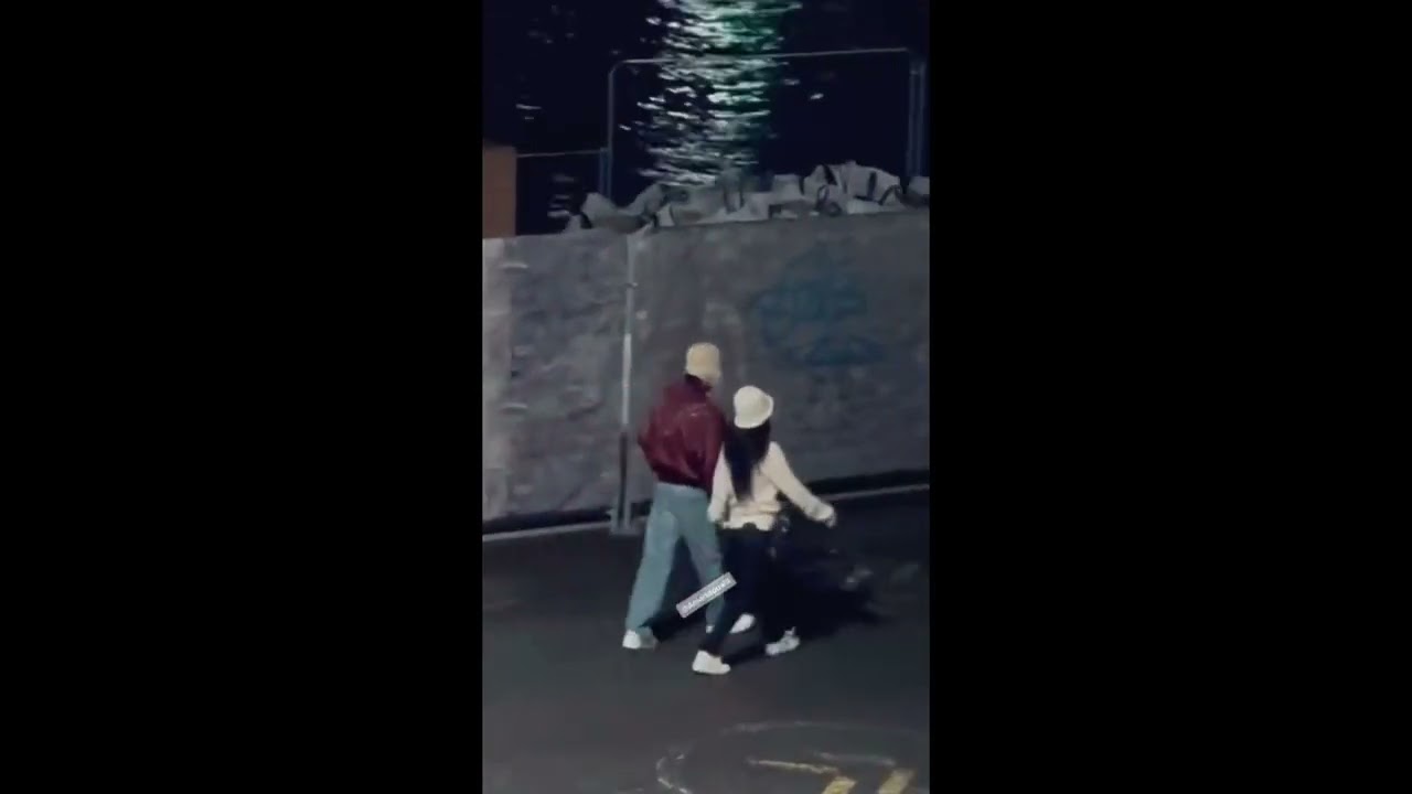 Taehyung and Jennie in Paris walking hand in hand in the City of Love