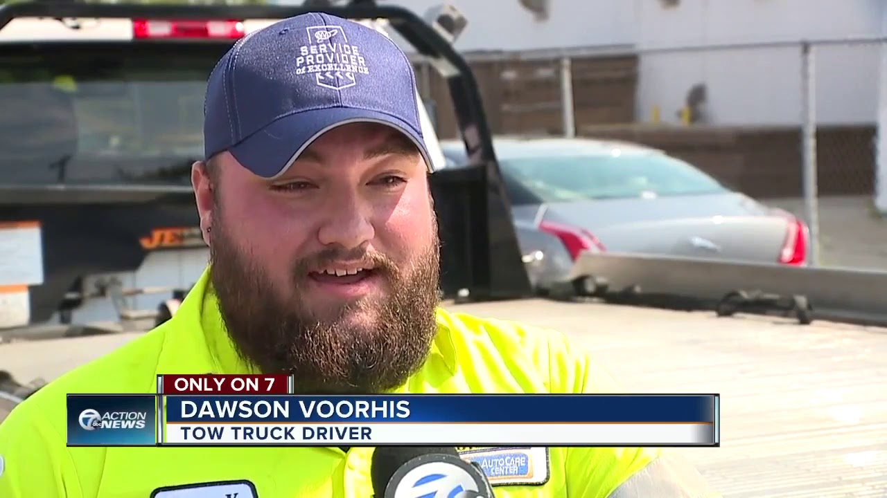Caught on camera: Tow truck driver just misses getting hit by SUV