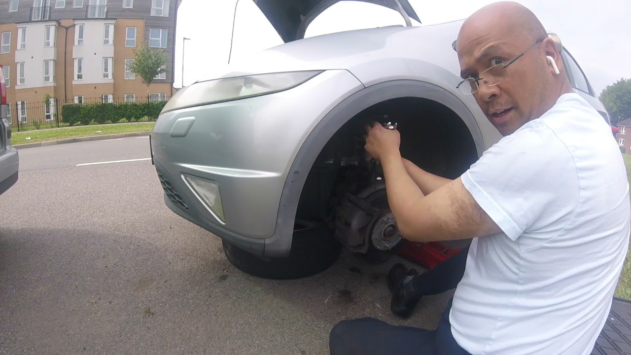 Front suspension spring and top mount replacement on a 2006 Honda Civic