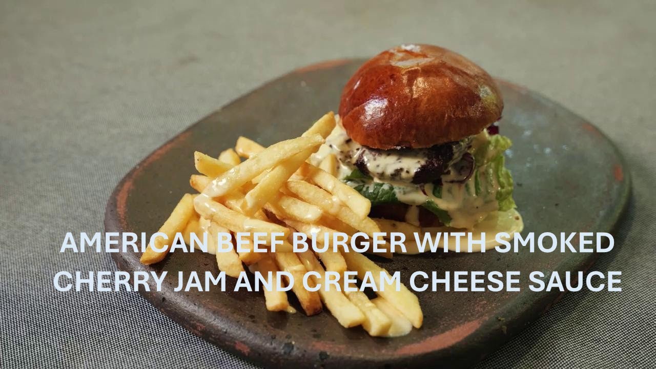 Burger with marbled beef, smoked cherry jam and cream cheese sauce
